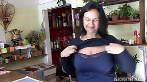 Mature saleswoman flashes her big tits and fucks for cash